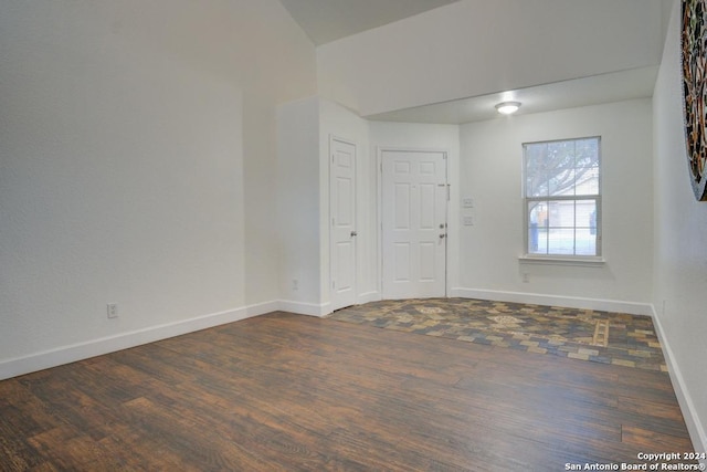 empty room featuring dark hardwood / wood-style flooring