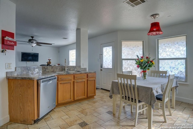 kitchen with dishwasher, a textured ceiling, ceiling fan, and sink