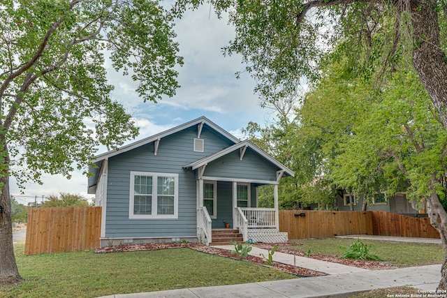 view of front of property with a front lawn and a porch