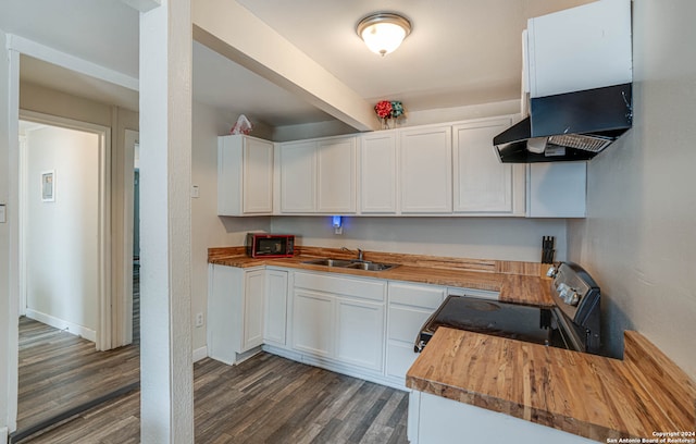 kitchen featuring wooden counters, range with electric cooktop, dark hardwood / wood-style flooring, white cabinets, and sink