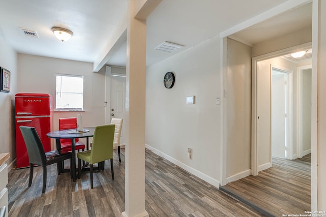 dining space with dark wood-type flooring