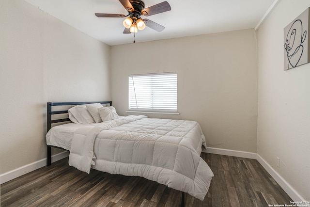 bedroom featuring dark wood-type flooring and ceiling fan