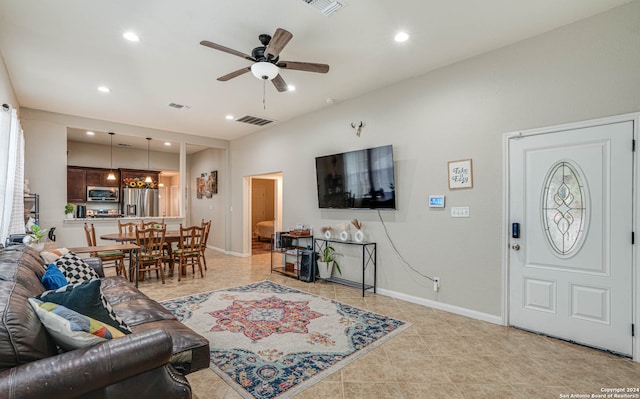 tiled living room featuring ceiling fan