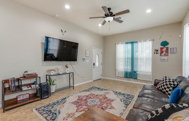 tiled living room featuring ceiling fan