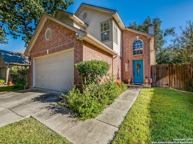 front of property with a garage and a front yard