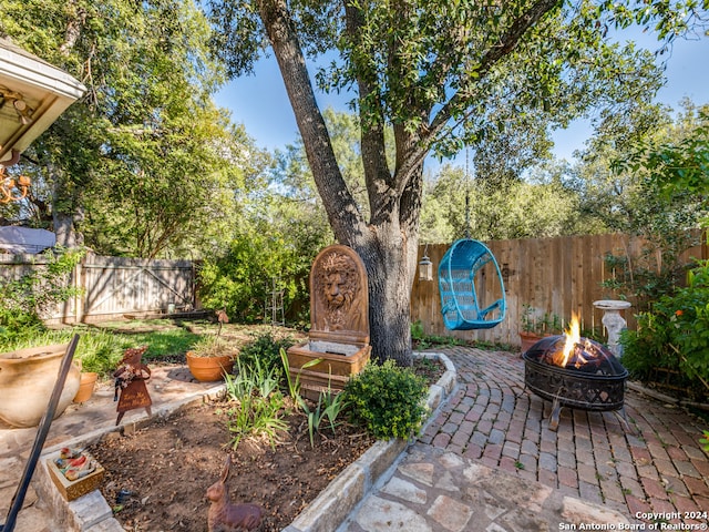 view of patio / terrace featuring an outdoor fire pit