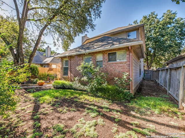 back of property with central AC unit