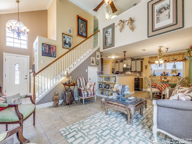 living room with a high ceiling, plenty of natural light, and light tile patterned floors