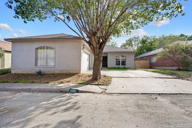 single story home with a garage