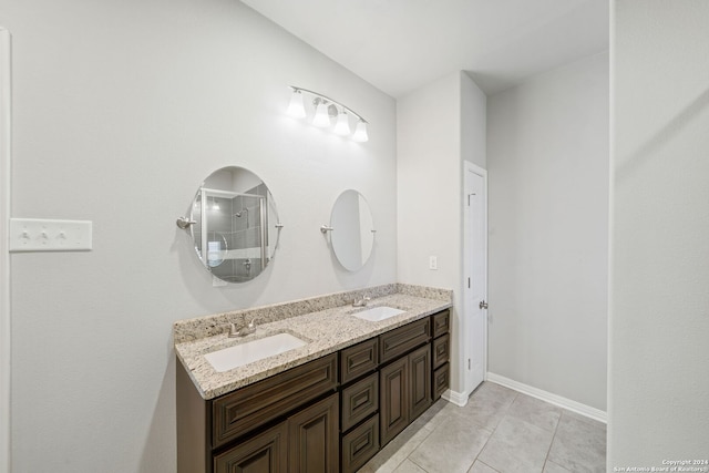 bathroom featuring tile patterned flooring and vanity