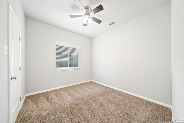 spare room with ceiling fan and carpet floors