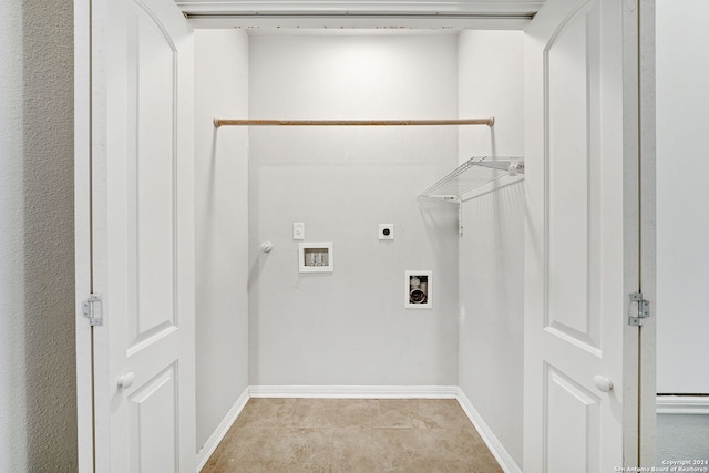 laundry area featuring gas dryer hookup, electric dryer hookup, hookup for a washing machine, and light tile patterned floors