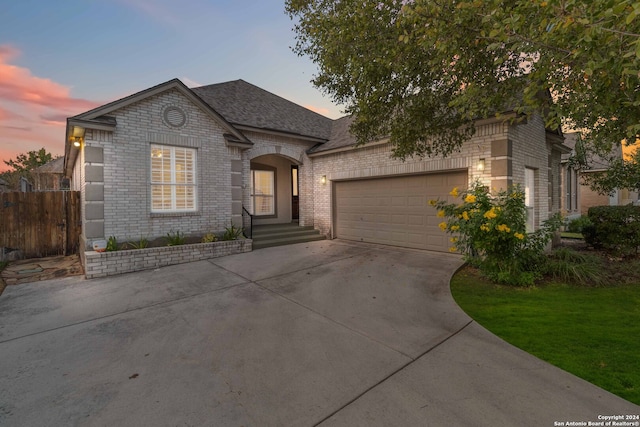 french country style house featuring a garage