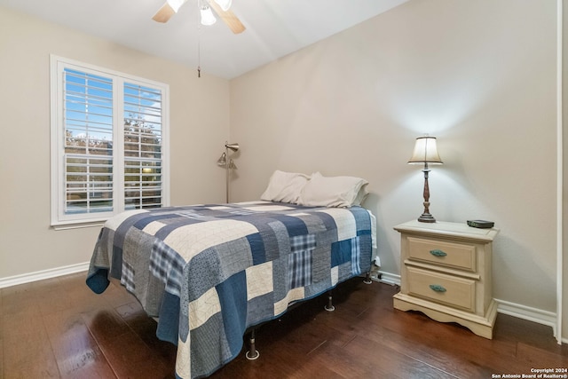 bedroom featuring ceiling fan and dark hardwood / wood-style flooring