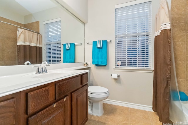 full bathroom featuring tile patterned floors, toilet, vanity, and shower / tub combo