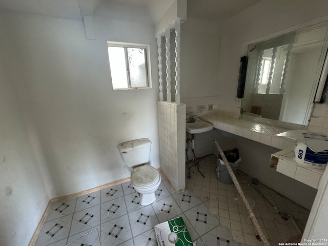 bathroom featuring tile patterned flooring and toilet