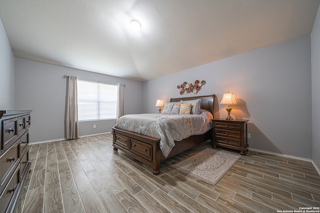 bedroom featuring hardwood / wood-style floors