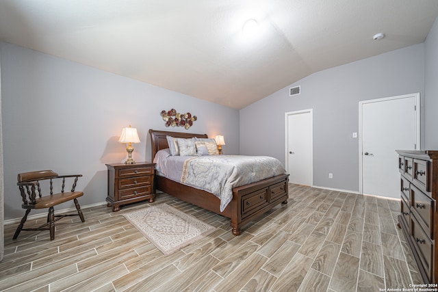 bedroom with vaulted ceiling