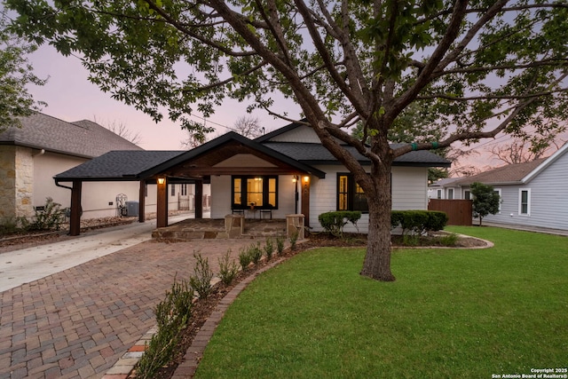 view of front of house with a yard