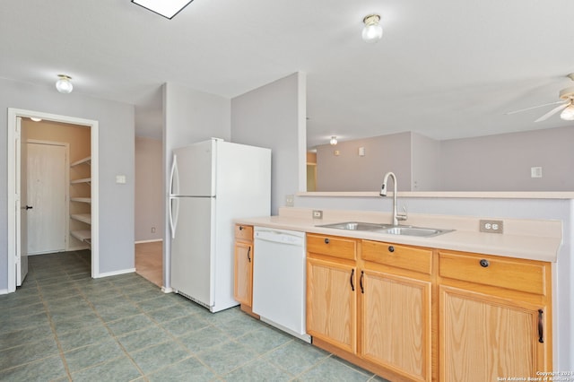 kitchen with white appliances, a sink, ceiling fan, and light countertops