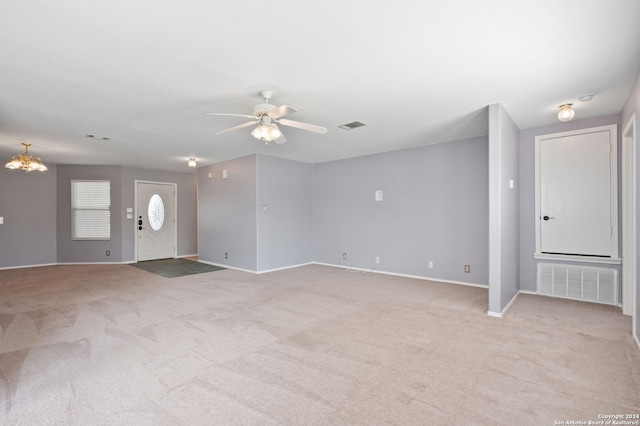 unfurnished living room with ceiling fan and light colored carpet