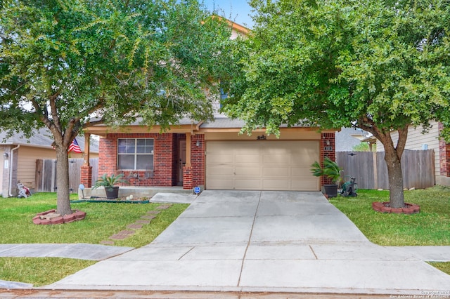 view of front of house featuring a garage and a front yard