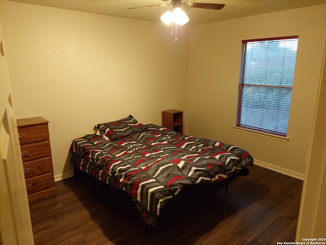 bedroom featuring ceiling fan and dark hardwood / wood-style floors