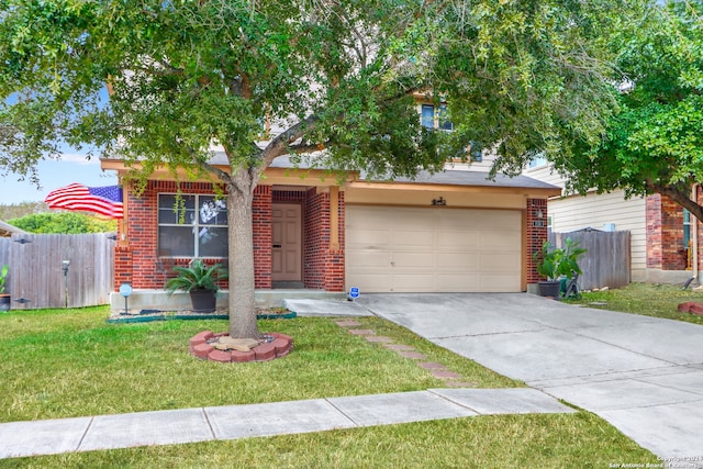 view of front of property featuring a garage and a front yard