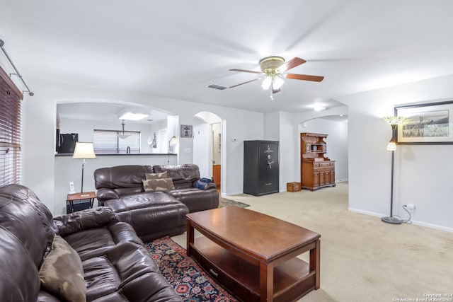 living room with light carpet and ceiling fan