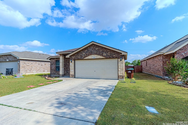 single story home with a garage and a front yard