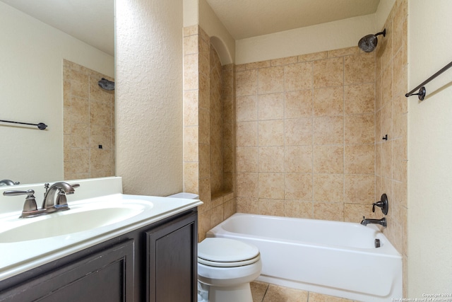 full bathroom featuring toilet, tile patterned floors, vanity, and tiled shower / bath combo