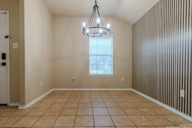 unfurnished dining area featuring light tile patterned floors, lofted ceiling, and a notable chandelier