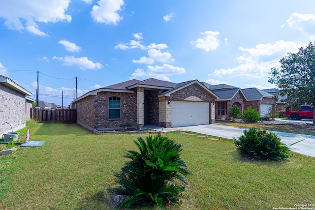 view of front of house featuring a front lawn and a garage