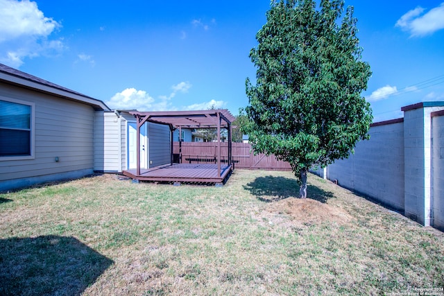 view of yard featuring a deck and a pergola