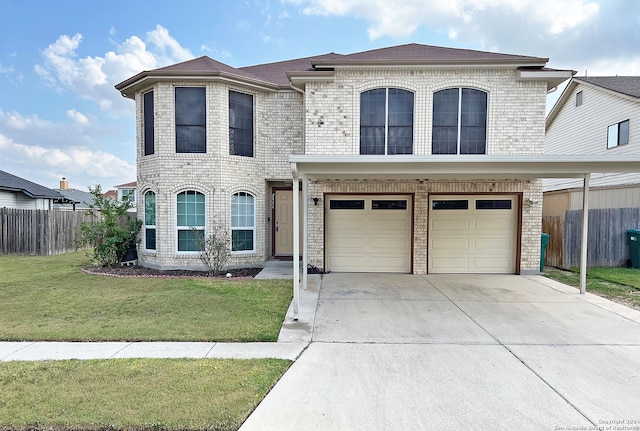 view of front of property with a front lawn and a garage