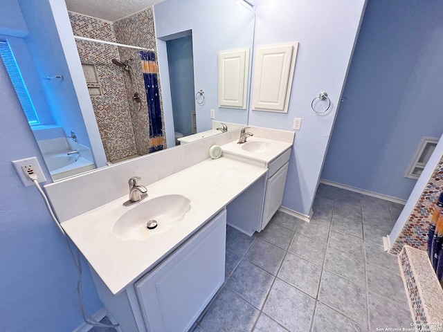 full bathroom featuring tile patterned flooring, vanity, toilet, and shower / tub combo