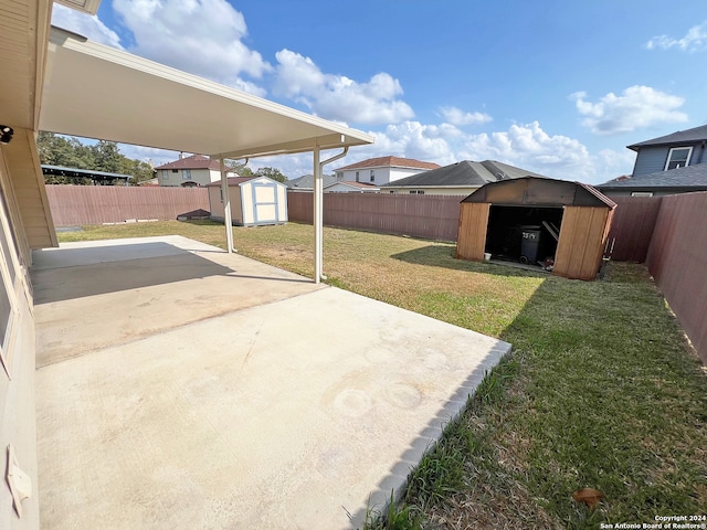 view of patio with a storage shed