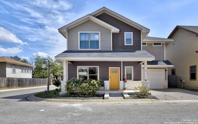 view of front of house with a garage and a porch