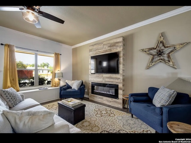 living room featuring a fireplace, ceiling fan, and ornamental molding