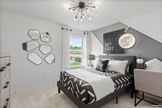 carpeted bedroom with a chandelier