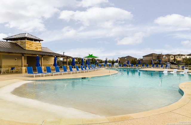 view of swimming pool featuring a patio area