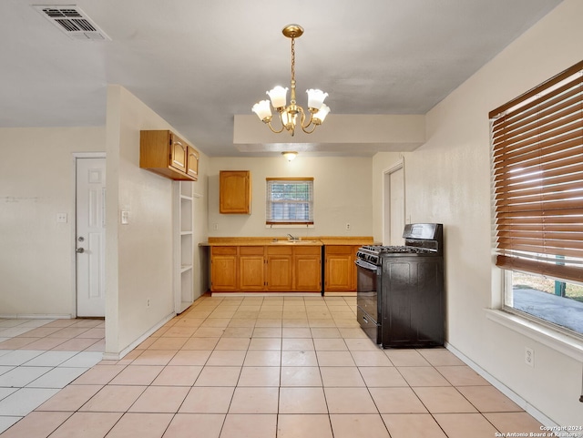 1818 Adamston Dr, San Antonio, TX 78220 - kitchen featuring black range with gas cooktop, a sink, a chandelier, and healthy amount of natural light