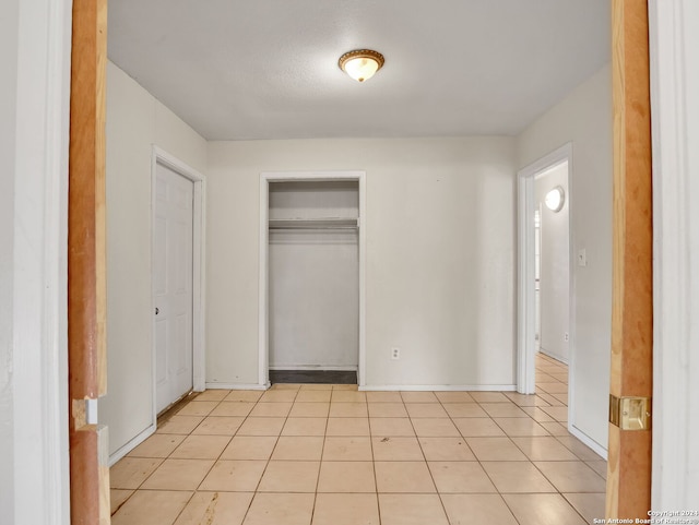 unfurnished bedroom with light tile patterned floors