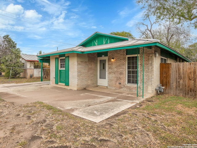 1818 Adamston Dr, San Antonio, TX 78220 - view of front of house featuring fence, brick siding, and a patio