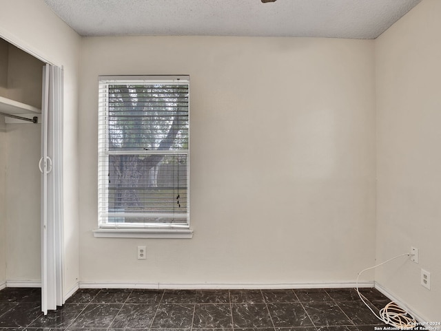 1818 Adamston Dr, San Antonio, TX 78220 - unfurnished bedroom with baseboards and a textured ceiling
