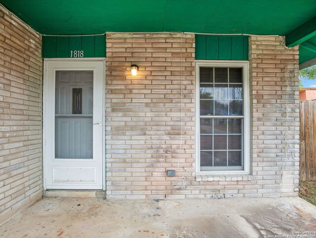 1818 Adamston Dr, San Antonio, TX 78220 - property entrance featuring board and batten siding and brick siding