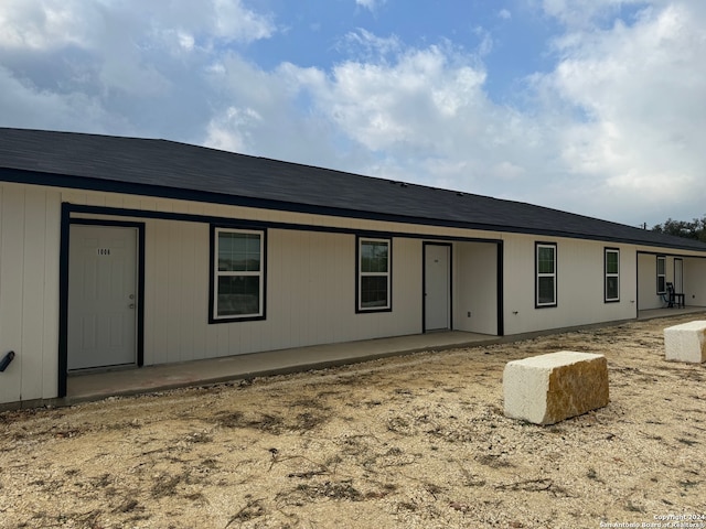 rear view of property featuring a patio area