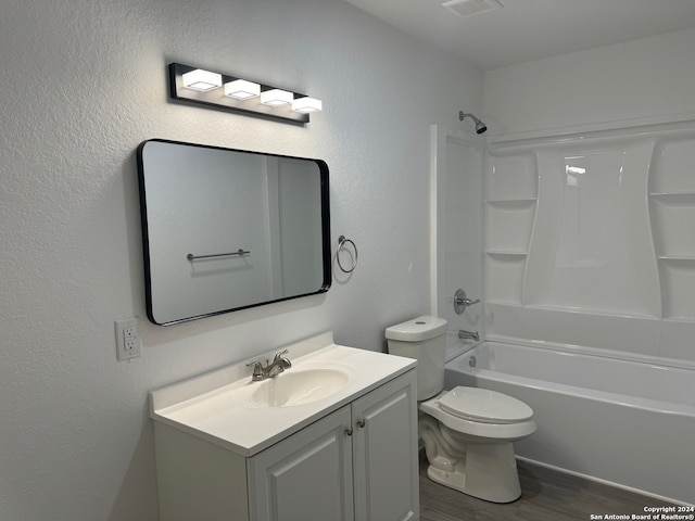 full bathroom with toilet, shower / bathing tub combination, vanity, and wood-type flooring