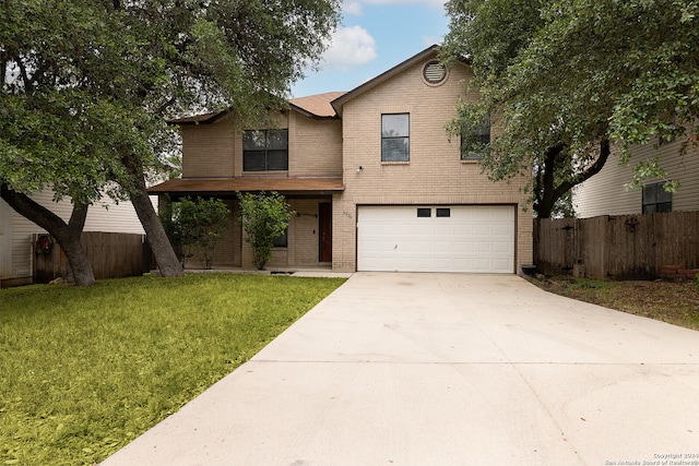 view of front property with a garage and a front yard