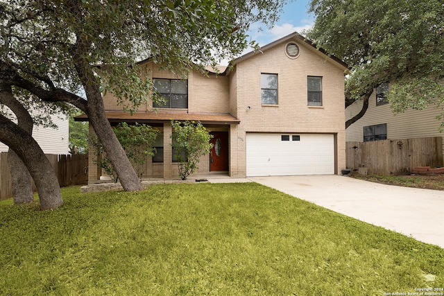 view of front of house with a garage and a front yard